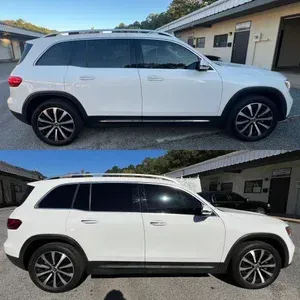 White SUV parked outdoors beside a building, shown in side profile from two similar angles.
