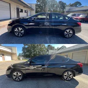 Black sedan shown from the side in two outdoor views beside a building and garage.