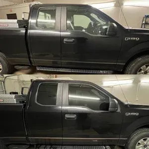Side view comparison of a black pickup truck before and after rear window tinting in a garage