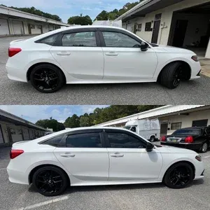 White sedan with black wheels parked in a driveway, shown in side view from two angles