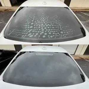 Car windshield before and after cleaning, showing removed water spots and stains