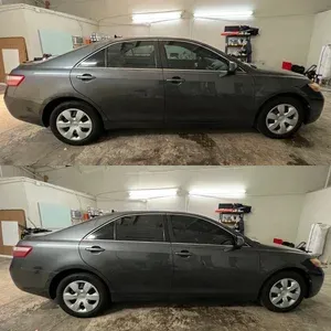 Side view of a gray sedan in a garage, shown in two stacked photos from slightly different angles