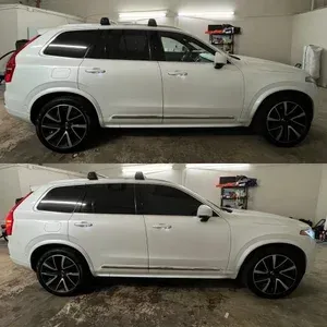 White SUV parked in a garage, shown in two side-view angles.
