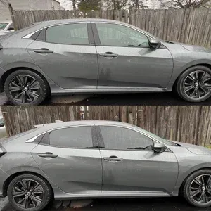 Two gray sedans shown in side profile, one above the other, parked in front of a wooden fence.