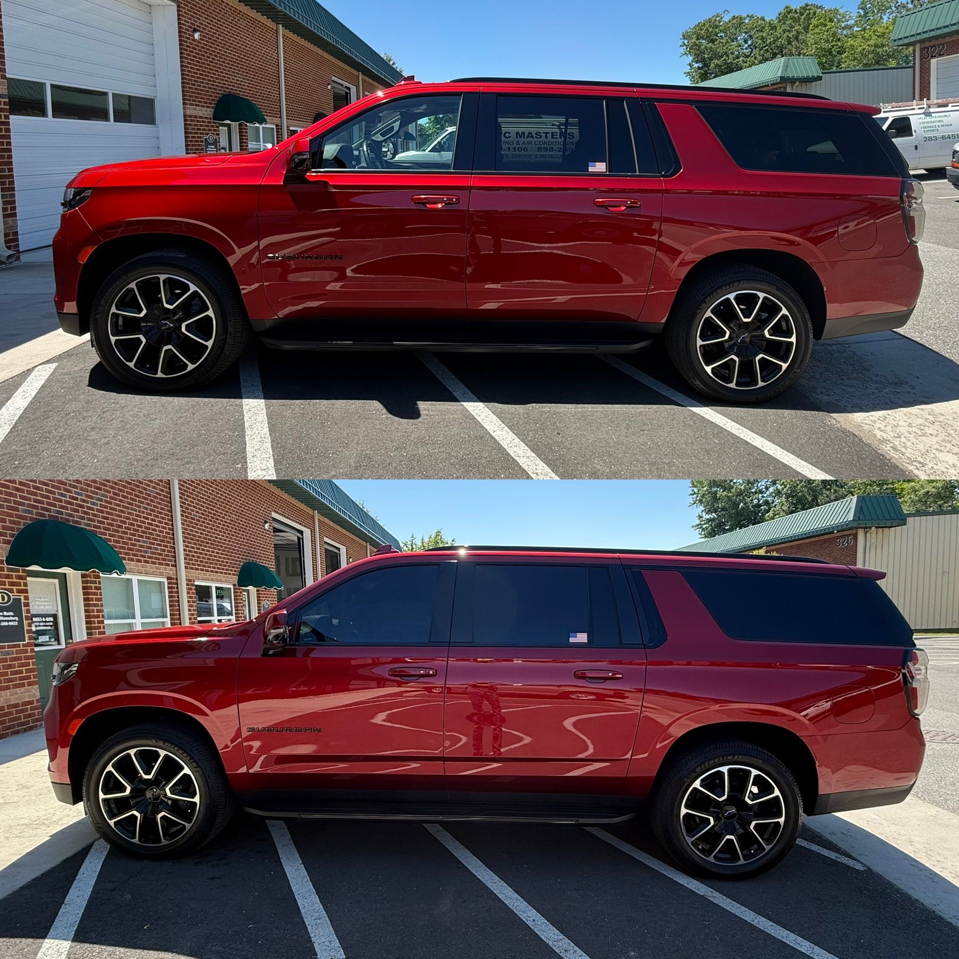 Red SUV parked in a striped lot, shown in side view under bright sunlight.