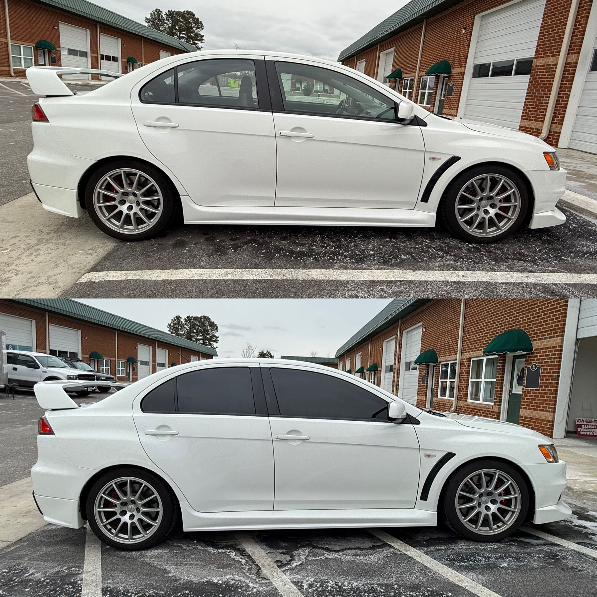 White sports sedan shown from side on a rainy residential street, with tinted windows and aftermarket wheels