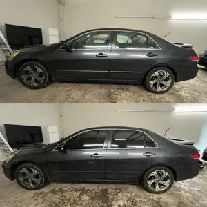 Black sedan shown in side view in a garage, with a before-and-after style split image.