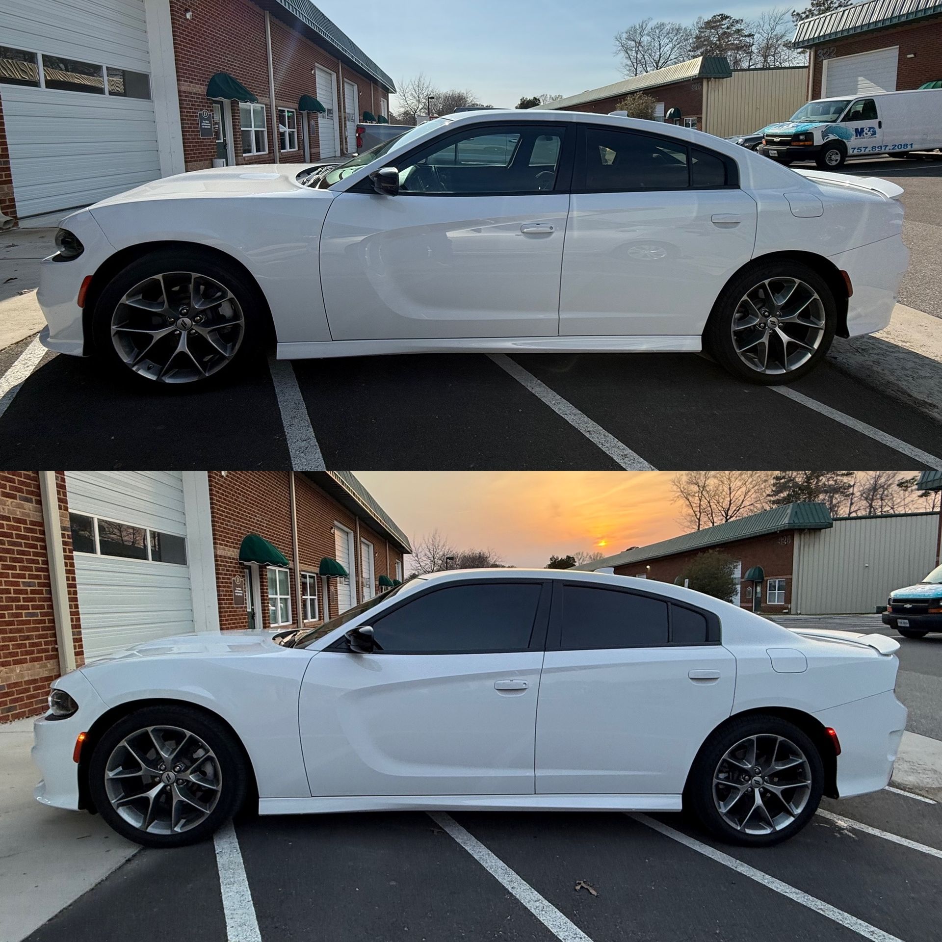 White sedan parked in a lot, shown in side view at dusk with sunset sky reflections.