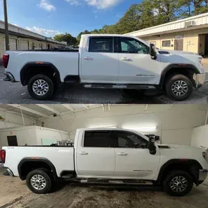White pickup truck shown in side view outdoors and indoors, with a rear wheel lift on the bed.