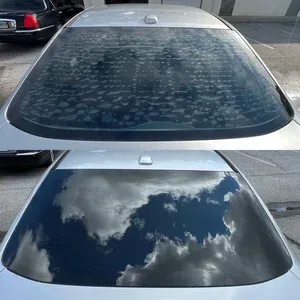 Top: dusty car rear window with water spots; bottom: same window cleaned, reflecting clouds and sky