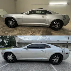 Silver Dodge Challenger shown in side profile indoors and outdoors, with custom black rims.