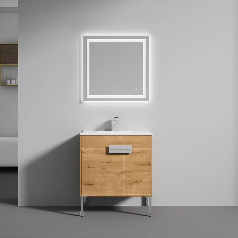 Bathroom vanity with a wood cabinet, white countertop, and illuminated mirror.