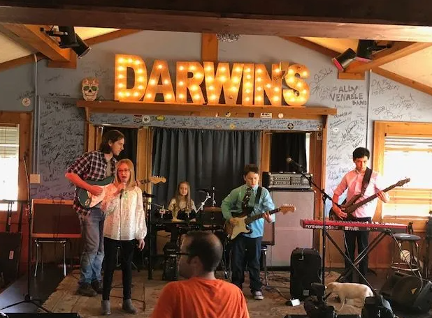 Band performing on a stage with 