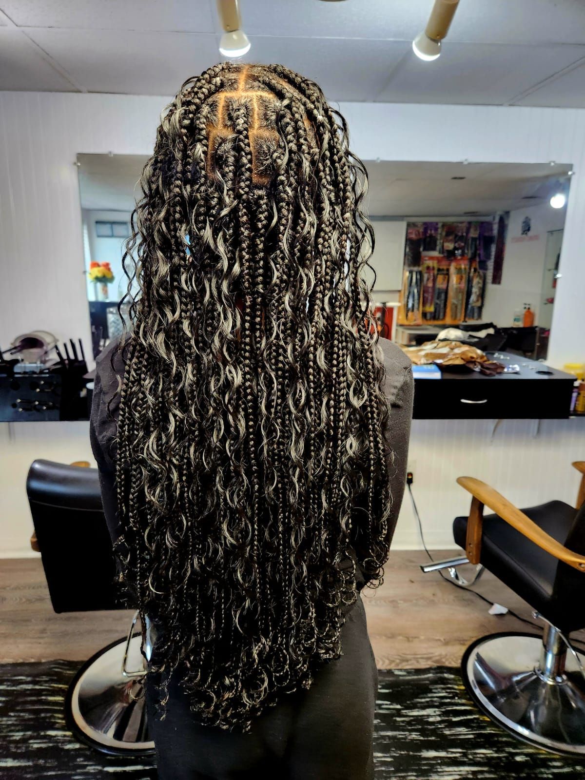 black hair color with braid and curly hairstyle