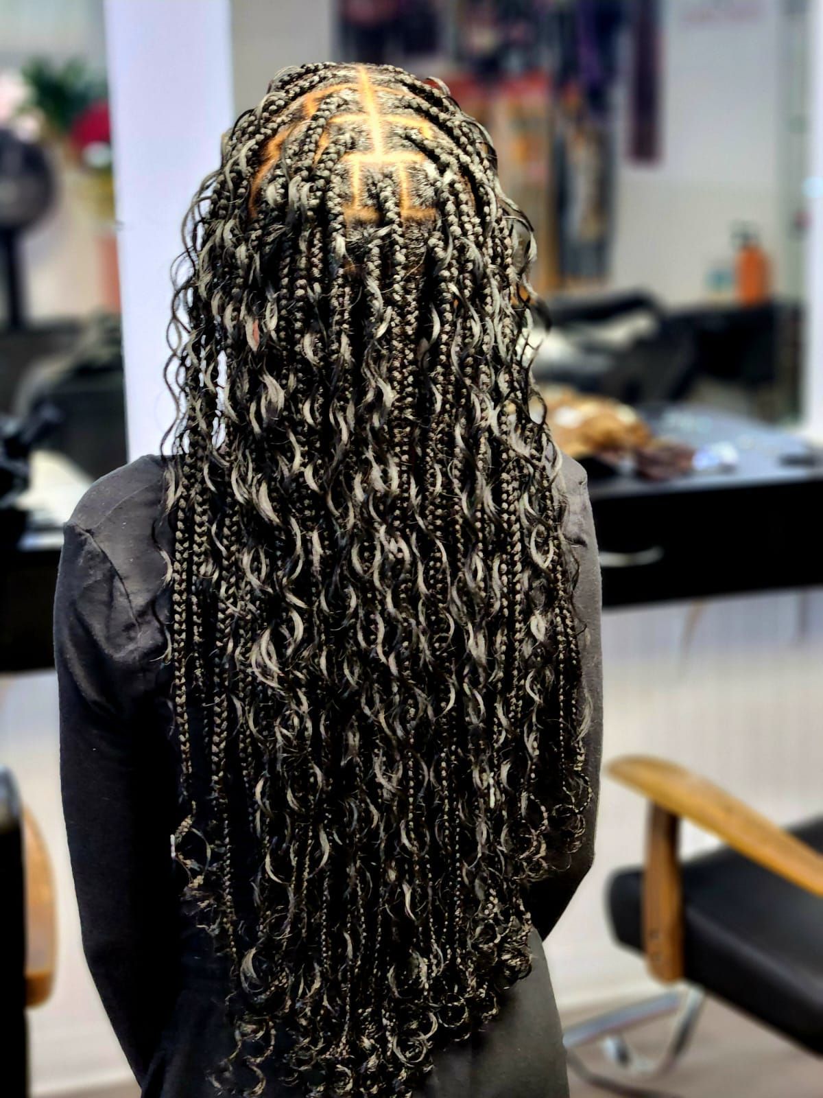 long black hair color with braid and curly hairstyle