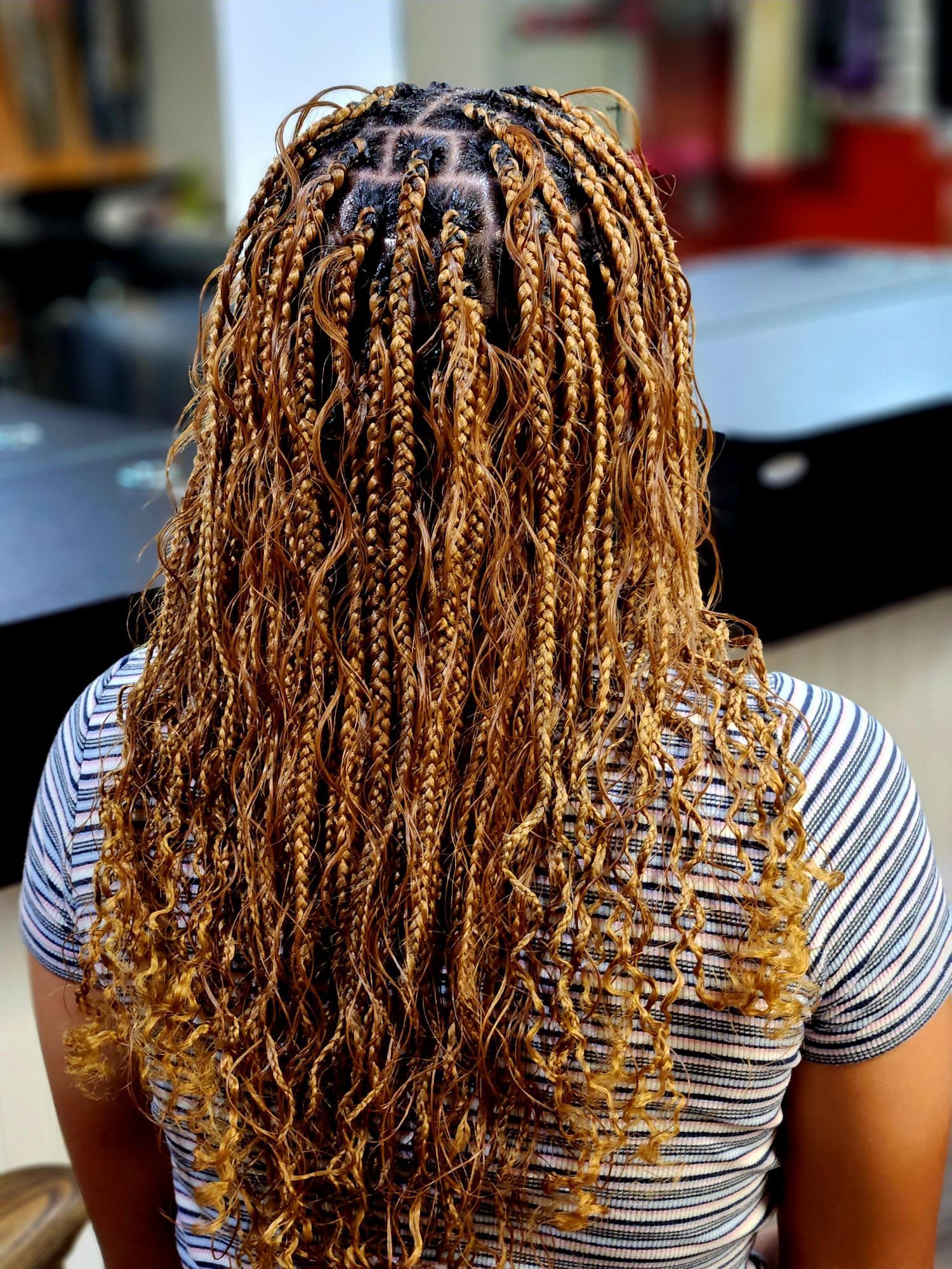 brown hair color with braid and curly hairstyle