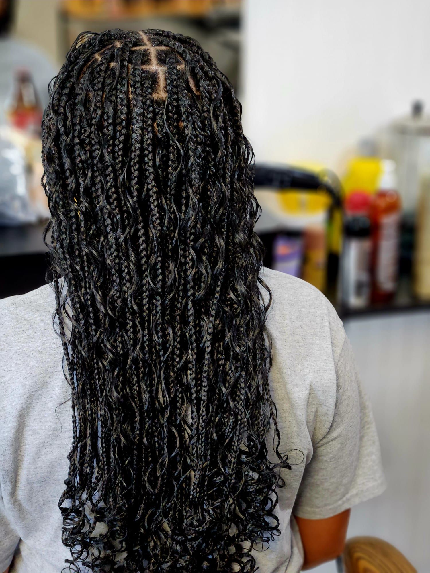beautiful black hair color with braid and curly hairstyle