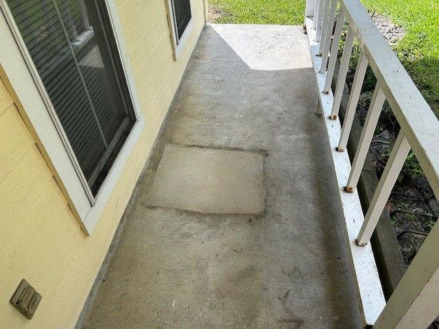 Concrete porch with a rectangular patch