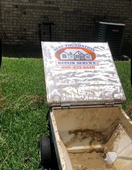 A white, dirty container with the logo