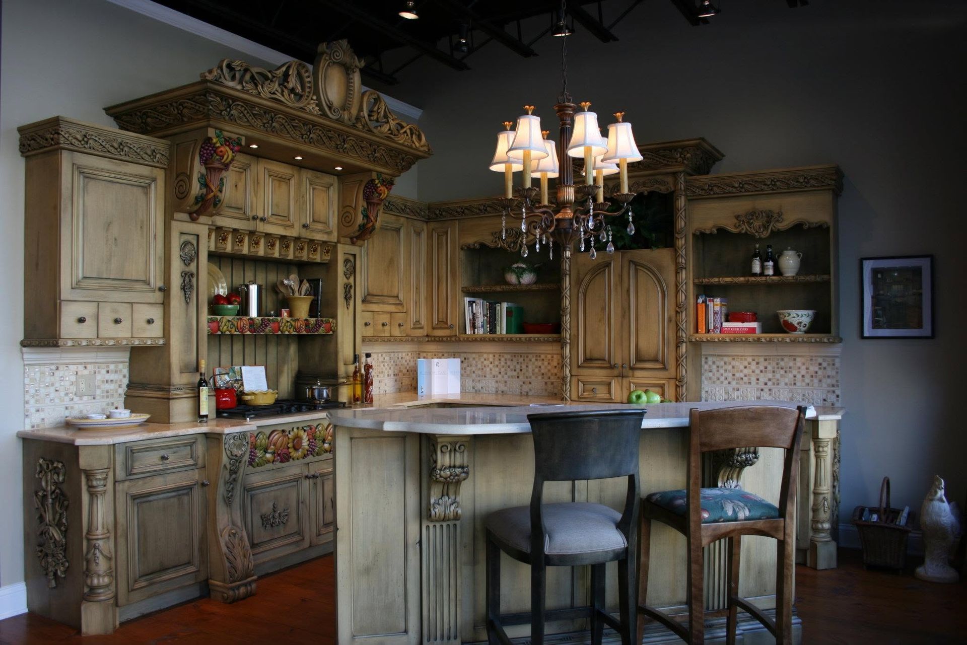 Rustic kitchen bar with carved cabinets, stone backsplash, pendant lights, and two high stools