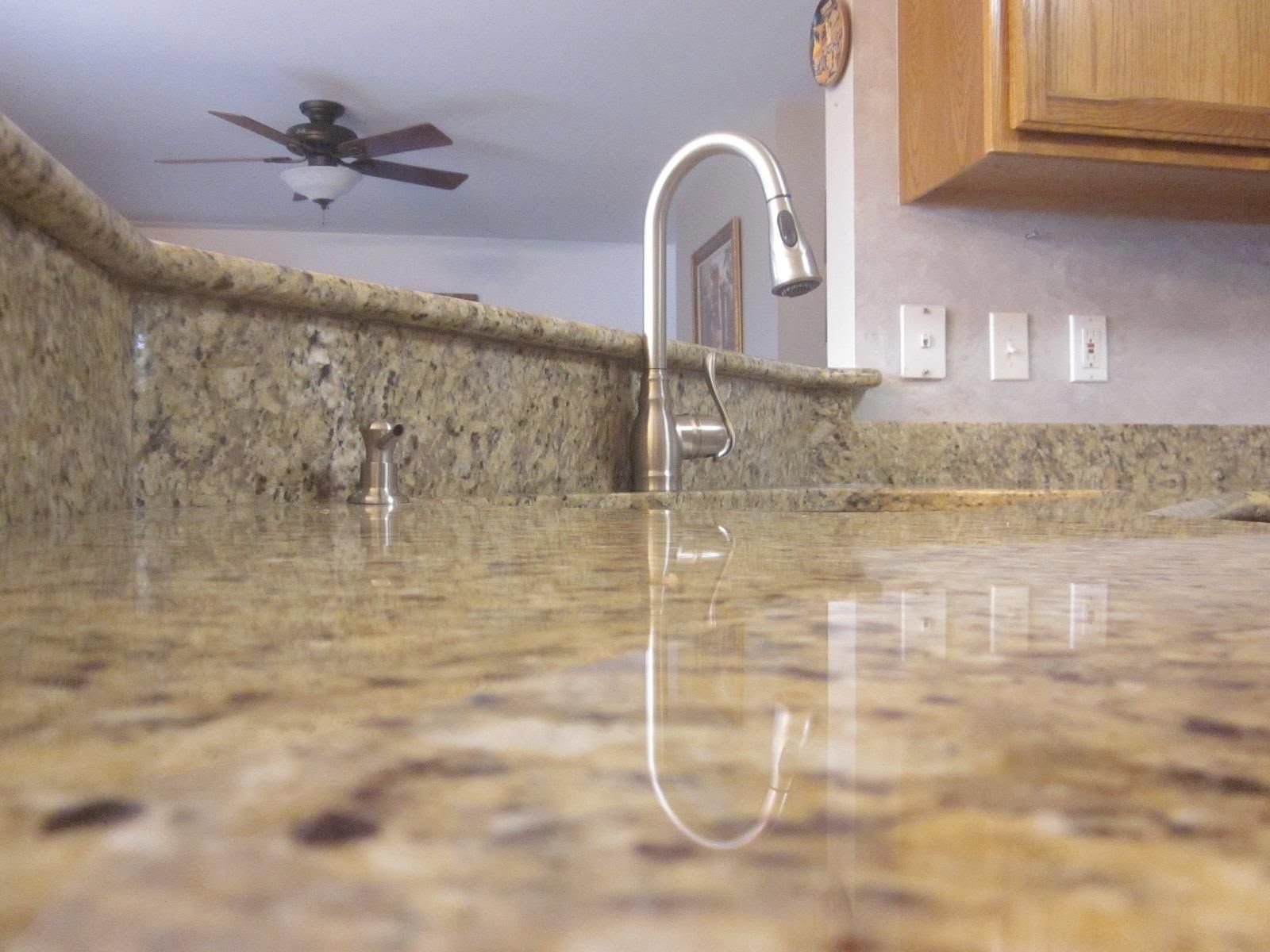 Kitchen flooded with muddy water up to the countertop and sink faucet