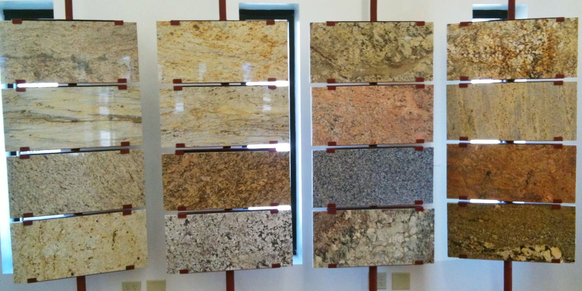 Rows of cork board samples in tan, brown, and gray, displayed side by side on a wall.