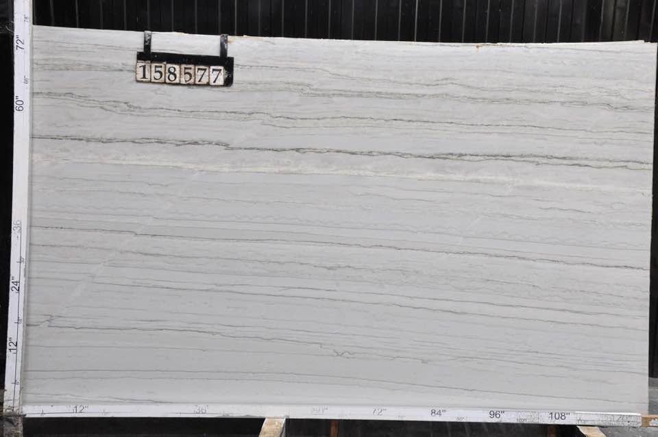 White painted panel or wall with a small number plate near the top left.