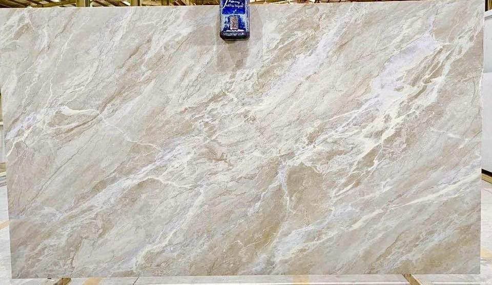 Beige marble-patterned tile sample with cream and tan veining, clipped at the top.