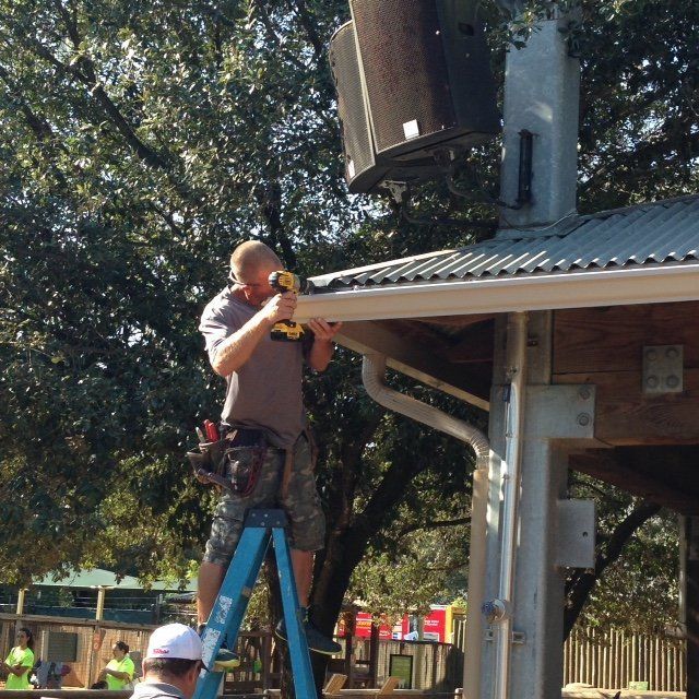 man installing Commercial Gutter