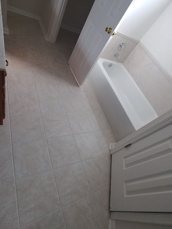 There is a bathtub in the middle of the bathroom.