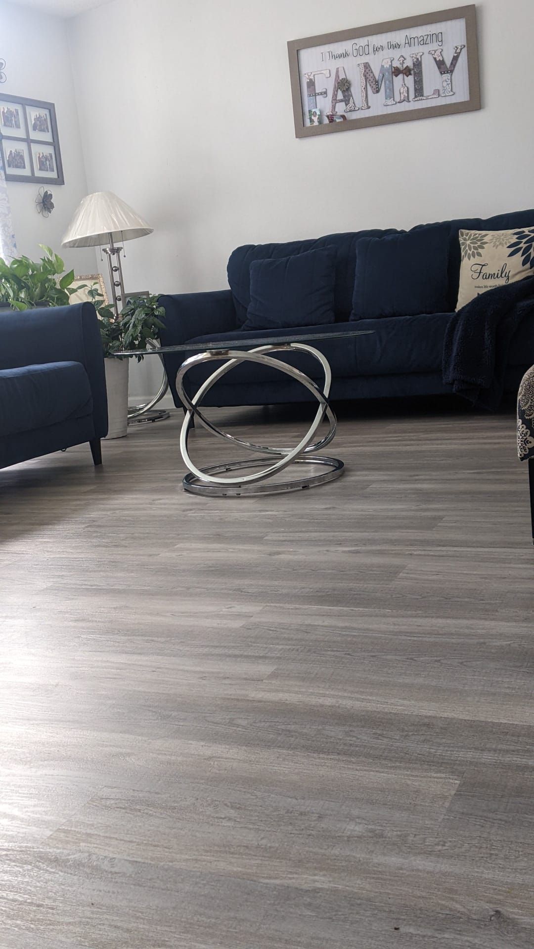A living room with a couch , chairs , and a coffee table.