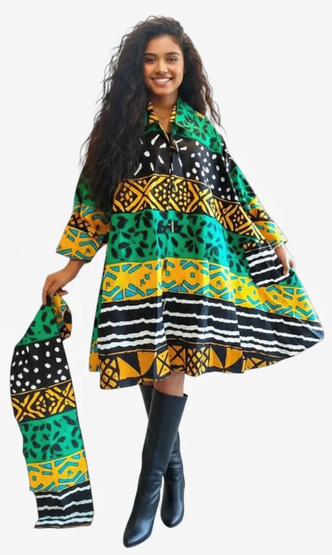 Woman wearing patterned dress and scarf with tall black boots.