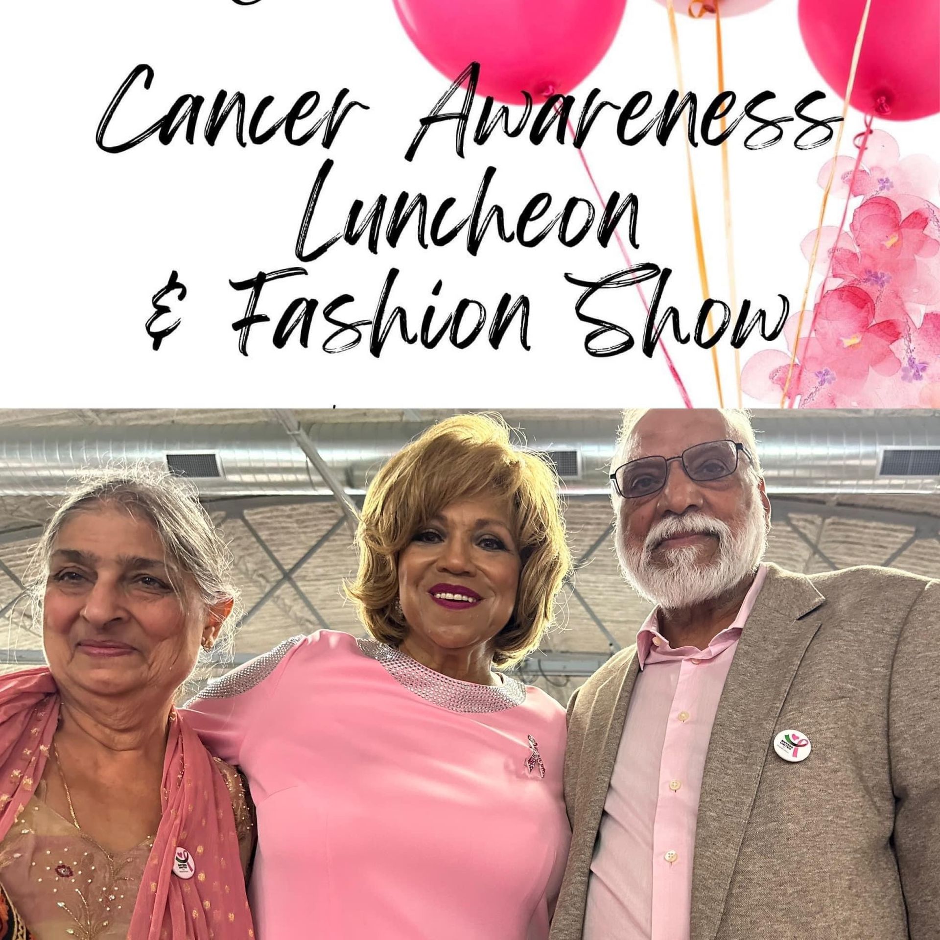 A group of people are posing for a picture at a cancer awareness luncheon and fashion show.