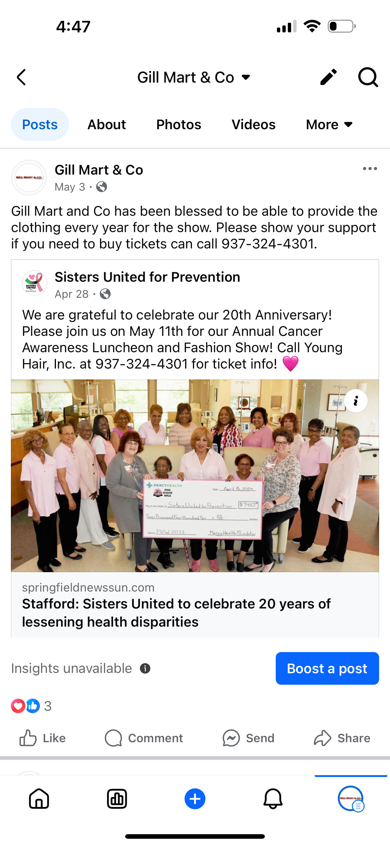 A group of people standing next to each other holding a large check.