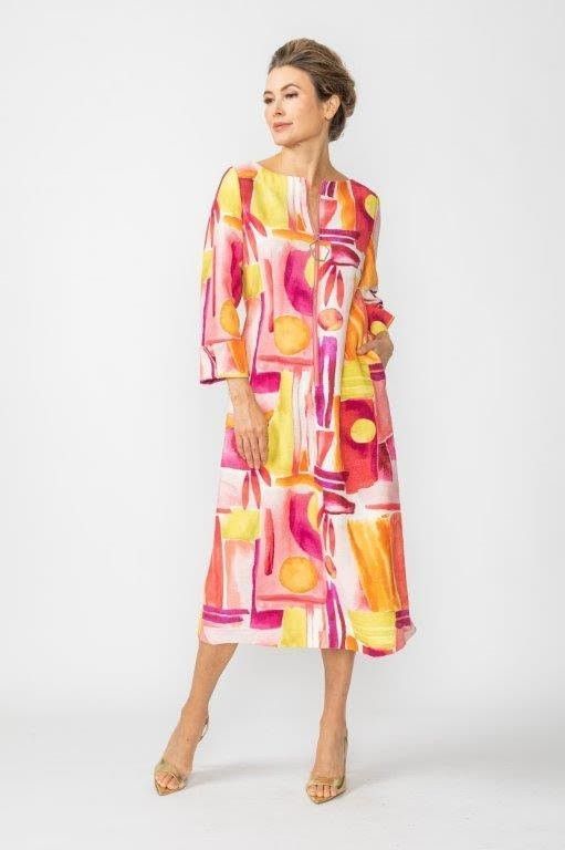 A woman is wearing a colorful dress and heels