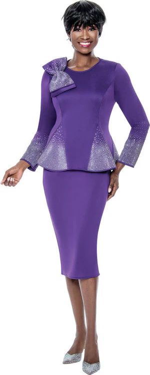 A woman in a purple suit is standing on a white background