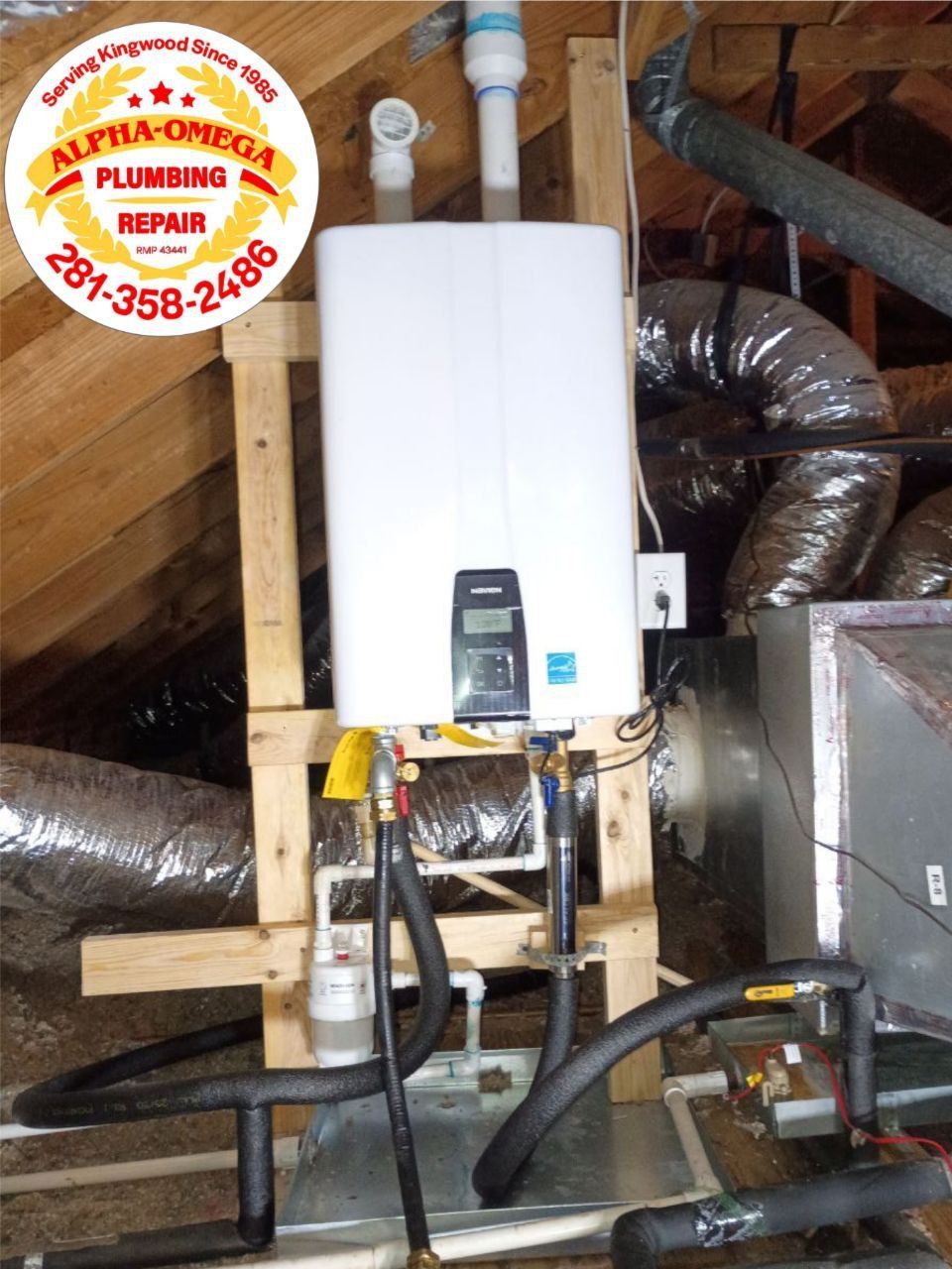 A white tankless water heater installed in an attic. Plumbing and ventilation visible.