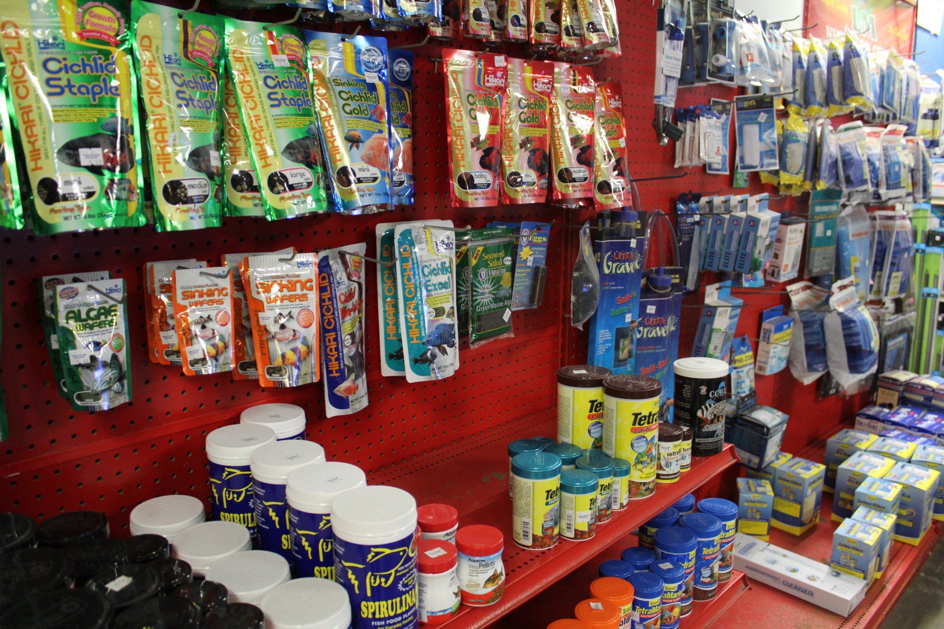 A store shelf filled with lots of fish food