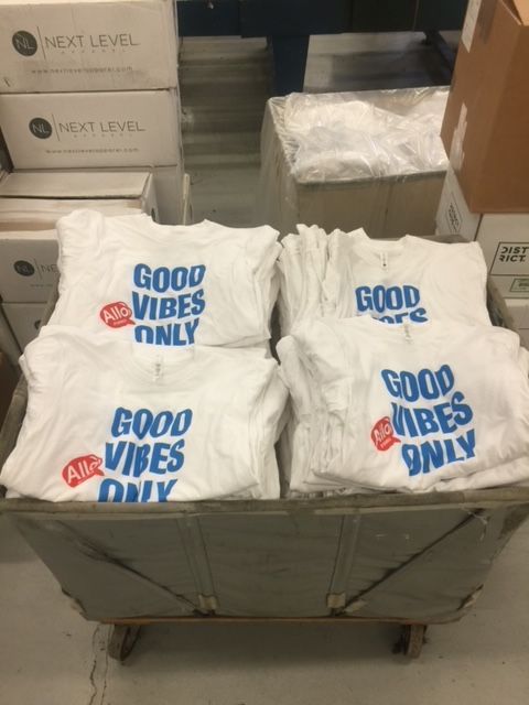 A bunch of shirts that say good vibes only