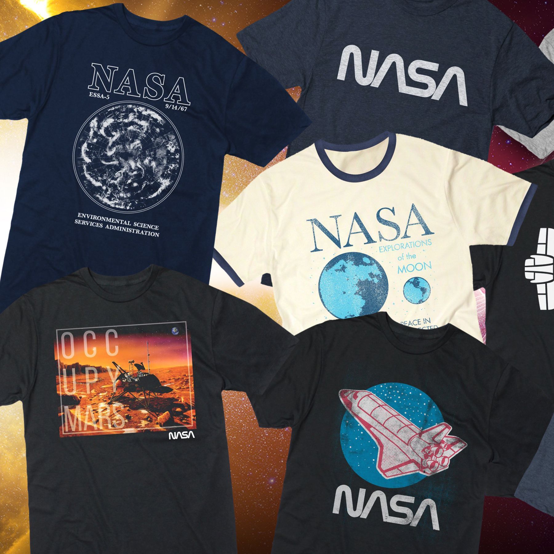A bunch of nasa t-shirts are on a table