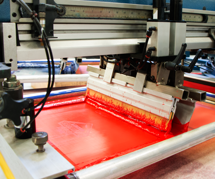 A machine is printing red on a piece of paper
