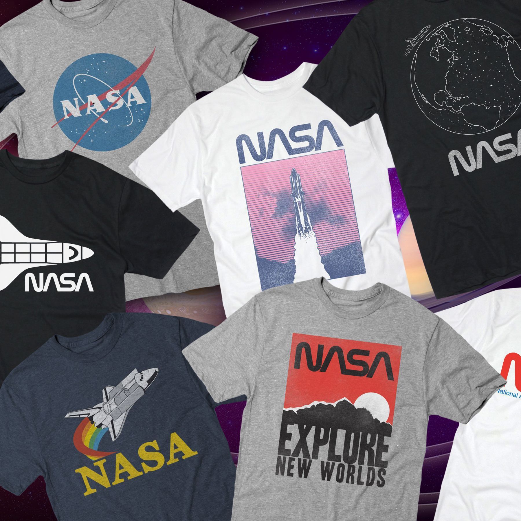 A bunch of nasa t-shirts are on a table