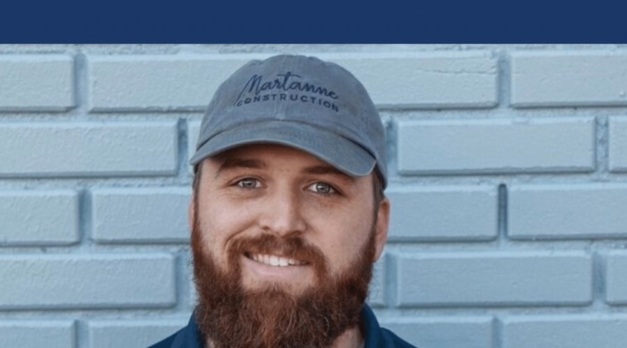 Man smiling, wearing a blue 