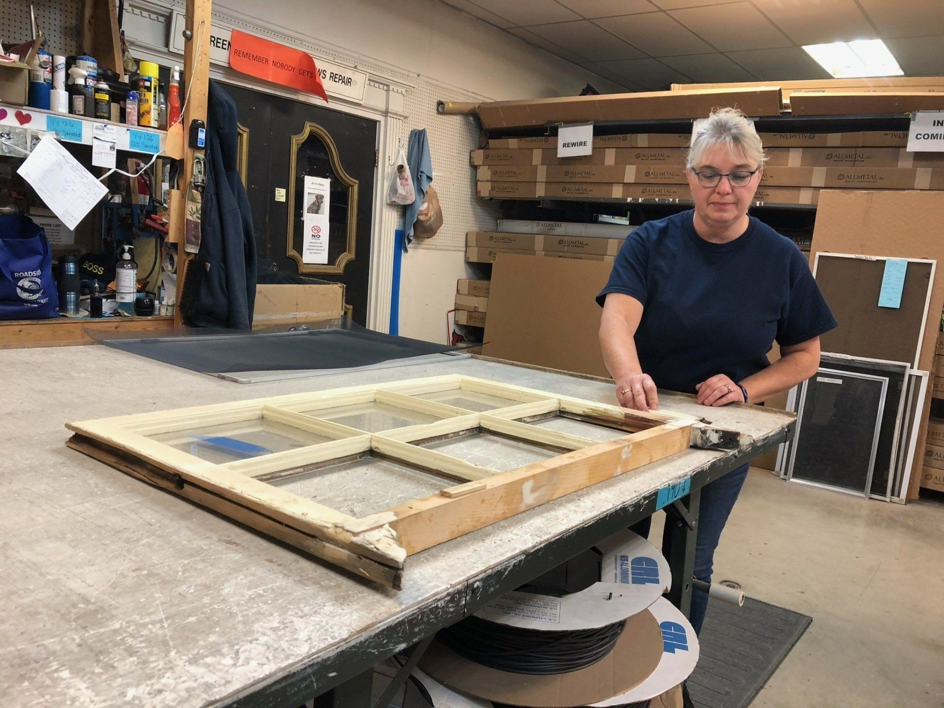 Staff restoring queen ann sash