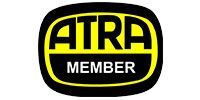 ATRA MEMBER logo in yellow and white on a black oval background
