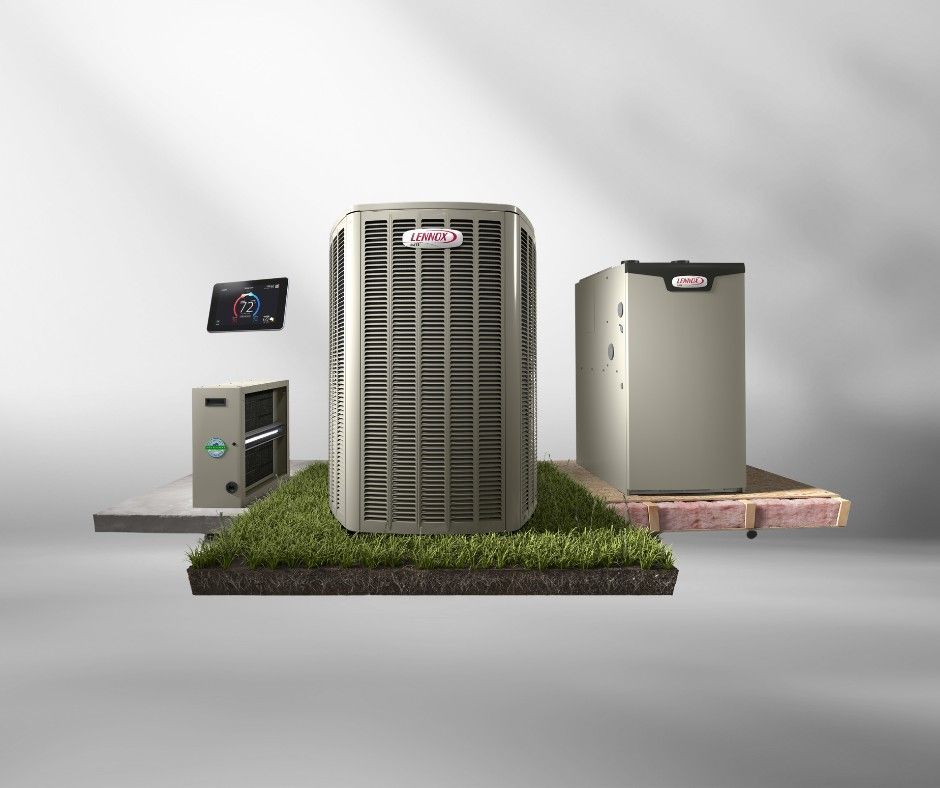 A group of air conditioners are sitting on top of a piece of grass.