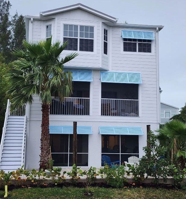 Bahama shutters installed on a residential home