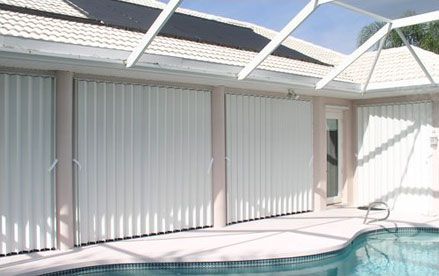 Closed accordion shutters for storm protection