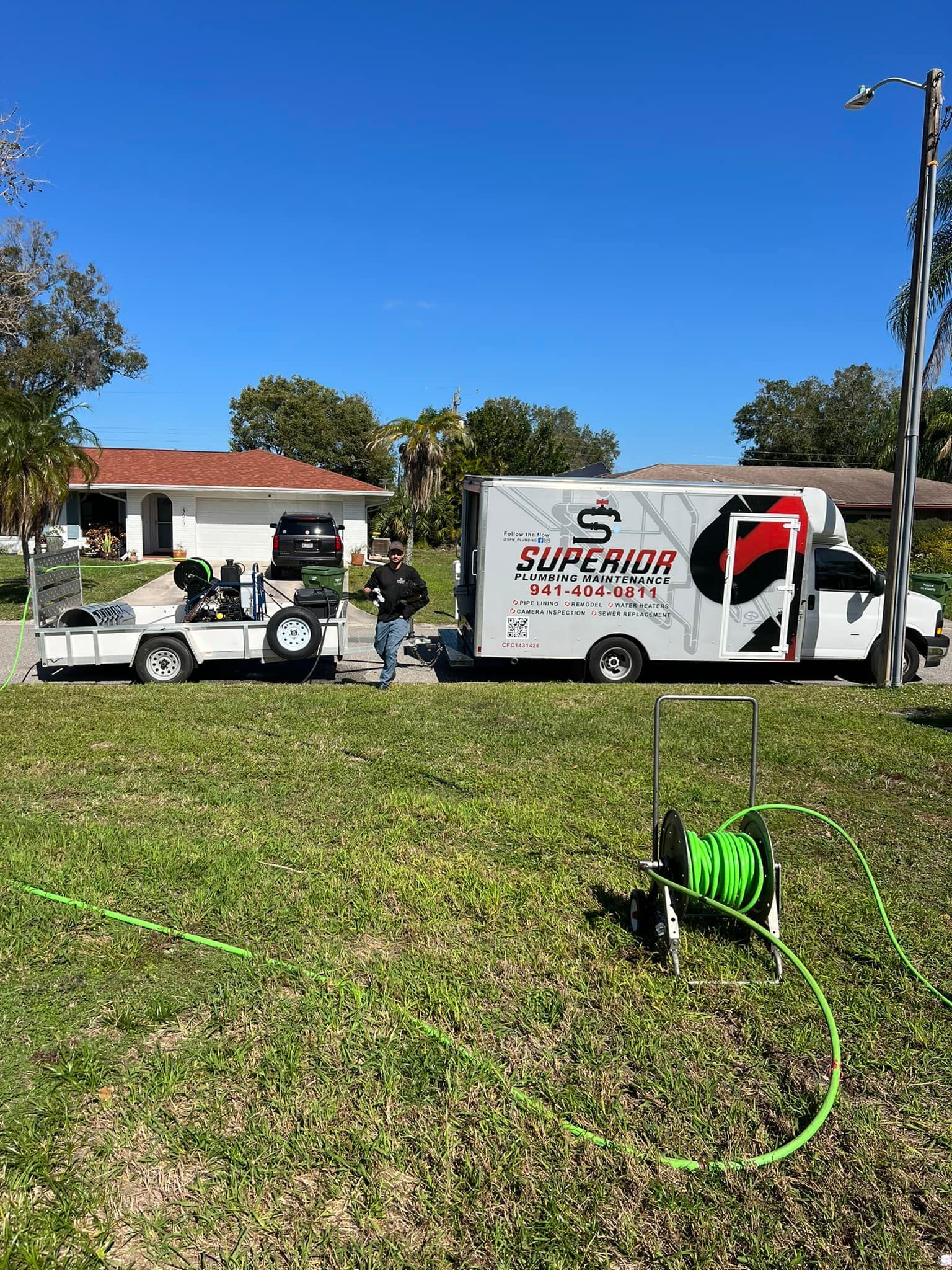 A white van and trailer with 