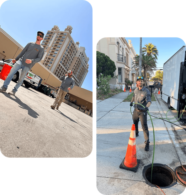 Two men in work shirts near a building and a van; one is working at a sewer access point, another stands nearby.
